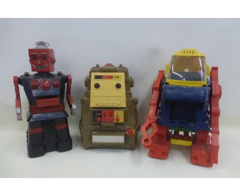 A large King plastic robot by Topper, a 1978 Megocorp tape playing robot - 2XL made in Taiwan and an electric robot possibly 