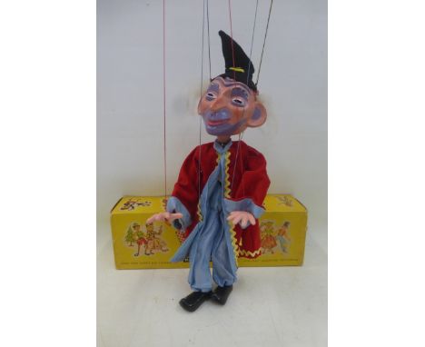 A mid 1960s 'Wizard' Pelham Puppet in excellent condition, red coat version, appears to have most of hair intact.