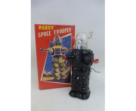 A boxed tinplate friction robot space trooper. 