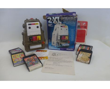 A boxed Burbank Toys 2-XL robot with cartridges.