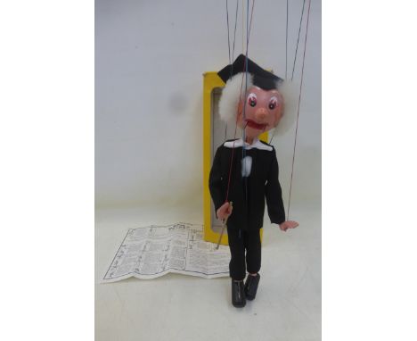 A boxed Pelham Puppet, probably early 1970s, 'Schoolmaster', packaged on a cardboard sleeve with tassle intact, by repute onl