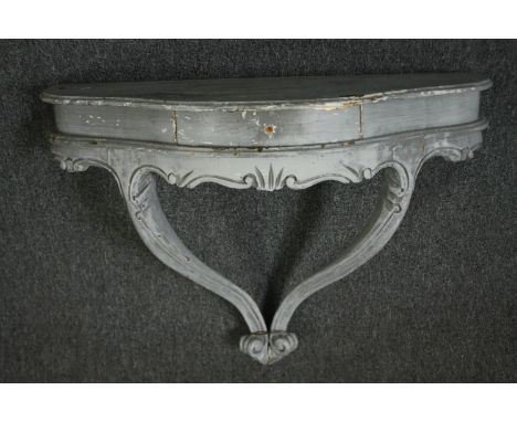 A French Louis XV style painted wall console or bracket. H.72 W.81 D.31cm. 