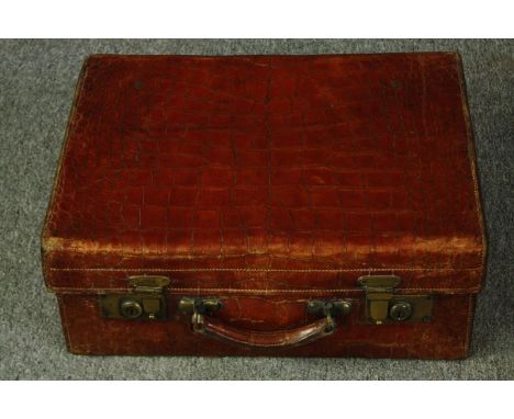 A vintage crocodile skin vanity case. H.19 W.48 D.36cm. 