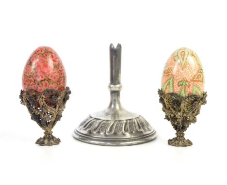 Two Victorian filigree egg cups, h5.5cm, together with two floral painted wooden and papier-mâché eggs, h6.5cm, and a silver 