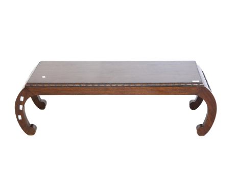 Modern Chinese hardwood low table with carved decoration and scroll feet, h34 x w115 x d48cm, 