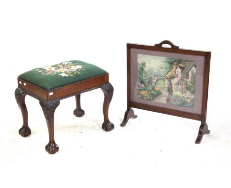 Early 20th century mahogany piano stool with tapestry seat on carved cabriole legs and ball and claw feet and a tapestry fire