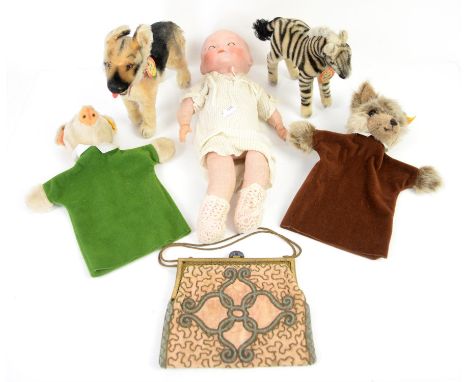 Armand Marseille doll, two Steiff glove puppets, Steiff Alsatian and Zebra and a beaded clutch bag, (6),