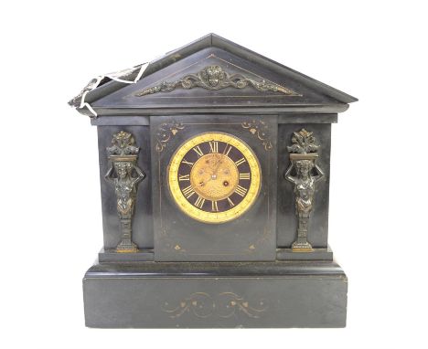 Late 19th century black slate mantel clock of architectural form, the dial with Roman numerals and visible Brocot escapement,