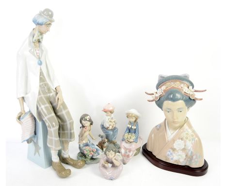  Lladro figure of a seated clown with accordion, 46cm four other Lladro figures and similar figure of a Geisha Condition Repo
