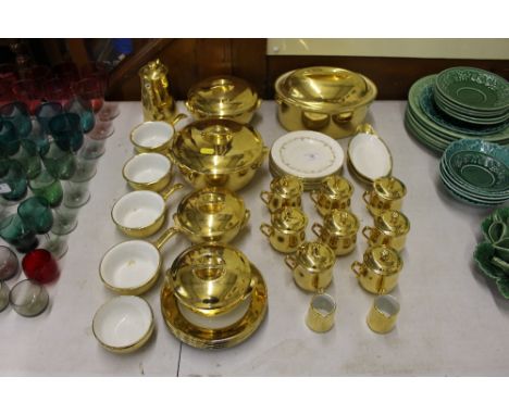 A quantity of Royal Worcester gilt decorated dinnerware to include tureens and covers, side plates etc. 