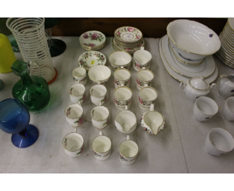 A quantity of Royal Worcester 'Royal Garden' coffee cups and saucers; and Royal Standard 'Orleans Rose' coffee cups and sauce
