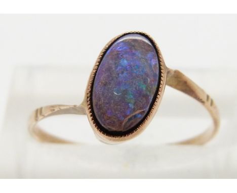 A 9ct gold ring set with an opal triplet, size L