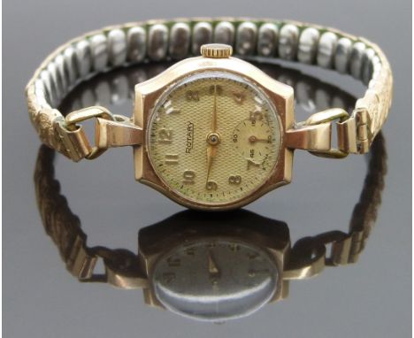 Rotary 9ct gold ladies wristwatch with inset subsidiary seconds dial, gold hands and Arabic numerals and chequered face, on e