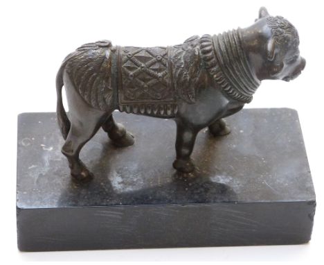 A bronze figure of a bull on marble plinth, height 10cm.&nbsp;