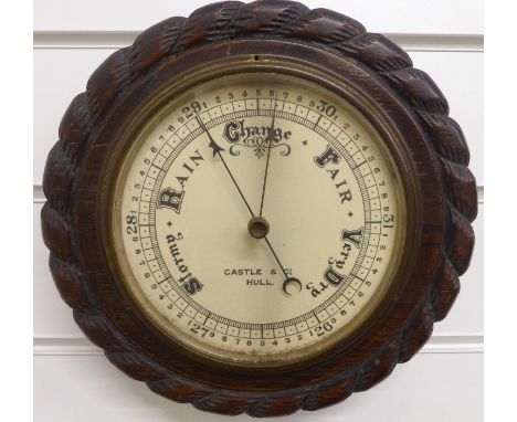 A circular aneroid barometer, c1930s, by Castle and Co, Hull, the painted ivory coloured dial with stylised predictions and m