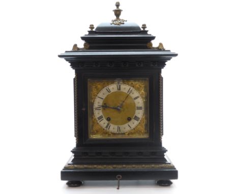 Late 19th Century mantel/shelf clock by R. M. Schneckenburger Roman silvered dial, brass/gilt spandrels in ebonized case, the