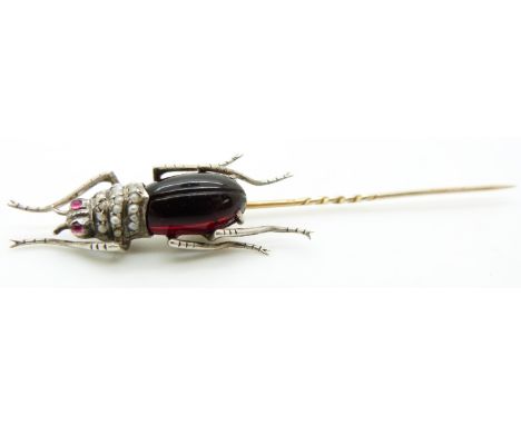 A Victorian stick pin in the form of an insect / beetle set with seed pearls and paste, 9.5cm long&nbsp;