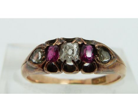 An 18ct gold ring set with diamonds and rubies, size K.