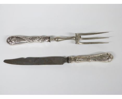 Continental white metal handled carving knife and fork, the floral embossed handles marked 800