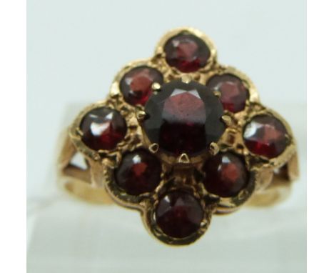 A 9ct gold ring set with garnets, size K
