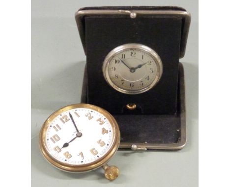 Travel alarm c1920s together with a similar 8 day Goliath style clock