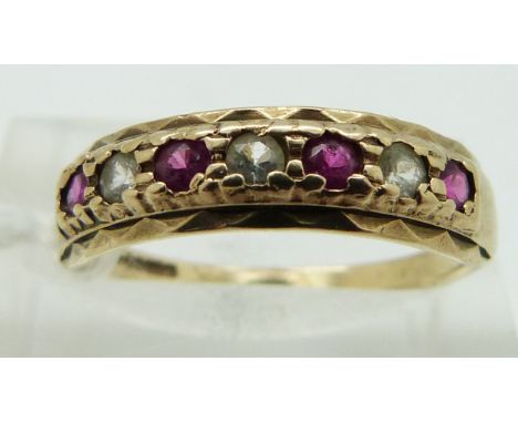 A 9ct gold ring set with rubies, size O