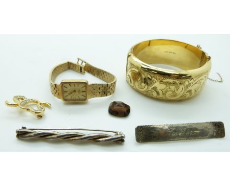 A rolled gold bangle, two silver brooches, Rotary watch and a brooch