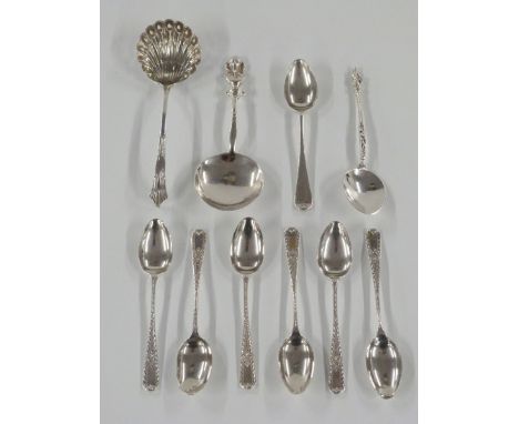 A quantity of hallmarked silver teaspoons including a set of six, hallmarked silver spoon and a hallmarked silver Shakespeare