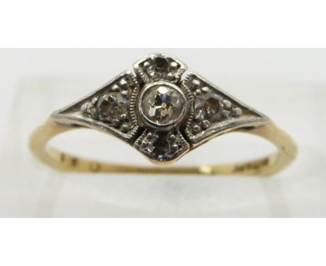 An 18ct gold ring set with diamonds in a platinum setting, size K