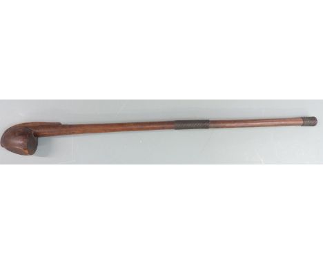 A 19thC African knobkerrie or throwing stick of unusual flattened form with wire grips/ mounts and carved detail to one side,