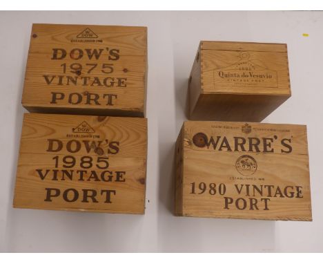 Four vintage port boxes/cases comprising Warre's 1980, Dow's 1985 and 1975 and Quinta de Vesuvio 1990