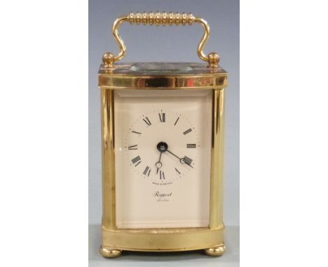 Twentieth century brass carriage clock by Rapport, London, with ivory coloured Roman dial and Breguet style hands, raised on 