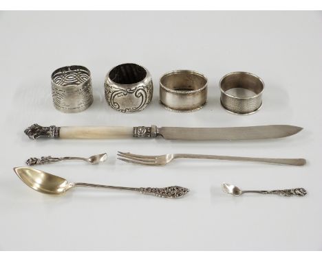 Three hallmarked silver napkin rings, hallmarked silver pickle fork and a part gilt spoon marked sterling, weight of all silv