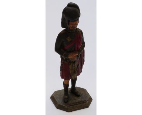 Spelter cold painted table lighter in the form of a Scottish Highland soldier, 23cm tall