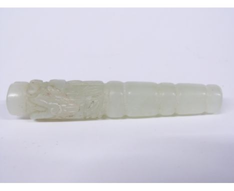 A 19thC carved jade mirror handle with dragon decoration, length 8.3cm