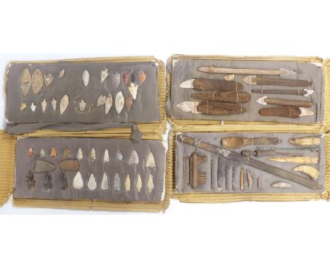 A collection of Neolithic and pre Columbian artefacts from Chile including arrow heads, spears, metal and bone implements, in