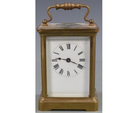 Early to mid twentieth century brass carriage clock in corniche style case, the white enamel dial with blued spade hands, 11c