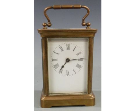 Early to mid twentieth century brass carriage clock in corniche style case, with white Roman dial and spade hands, 11cm tall