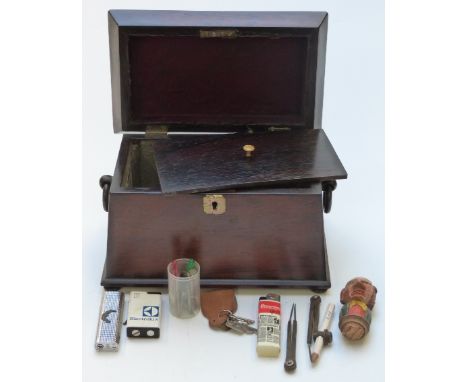 A 19thC rosewood sarcophagus shaped two division tea caddy with loop handles, raised on ball feet, H 15cm x W 23cm x D 15cm&n