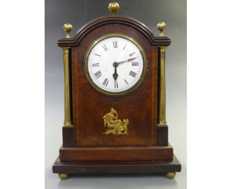 Georgian mantel clock, the enamel Roman dial with steel spade hands, the inlaid mahogany veneered case with brass column, fin