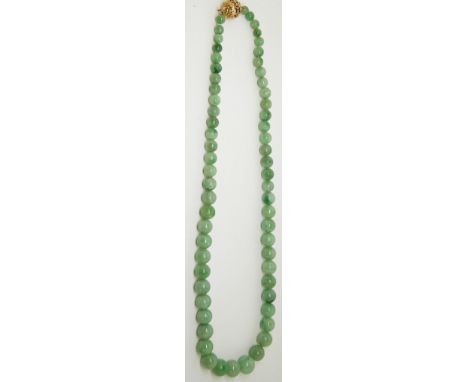 A jade necklace made up of spherical graduated beads, with&nbsp; filigree clasp length 50cm&nbsp;