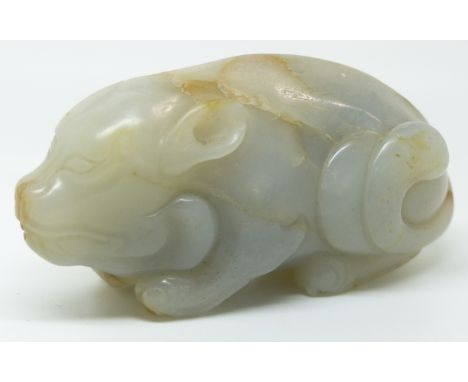 A 19thC carved jade figure of a recumbent pig, height 4cm x length 7.5cm