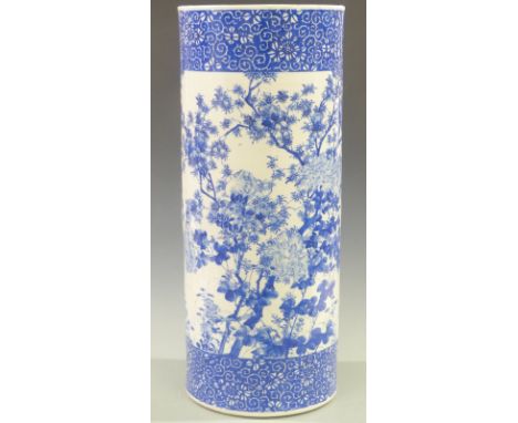 A 19th/20thC Chinese blue and white porcelain stick/umbrella stand decorated with three peonies, height 63cm