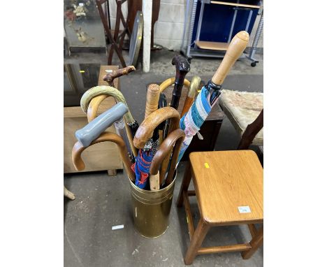 Brass stick stand and contents
