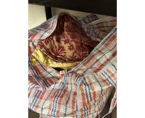 A bag of red and gilt assorted curtains and household linens