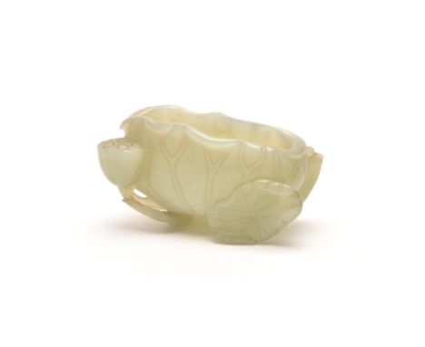 A Chinese small celadon jade water pot, Qing Dynasty, 18th century, well carved with the leaf and stem of the water pot formi