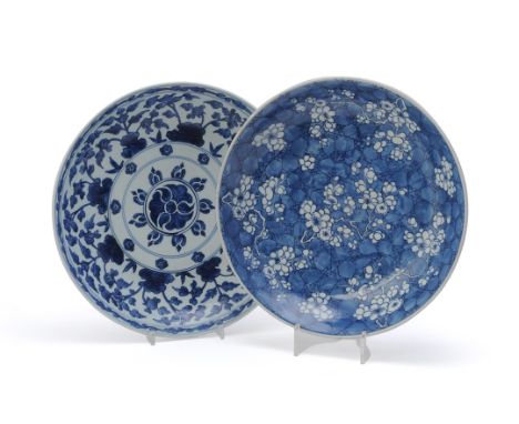 A Chinese blue and white 'Prunus' dish, Kangxi, with sprays of prunus on a 'cracked-ice' ground, 34.5cm diameter and a Chines