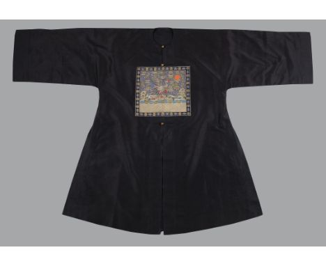 A Chinese Mandarin's Chinese Surcoat, pufu, Qing Dynasty, late 19th century, circa 1890, of deep blue, applied with a pair of