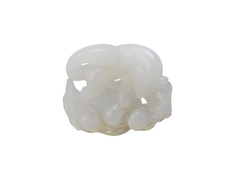 A Chinese white jade 'Squirrel and Grapes' group, Qing Dynasty, carved and pierced with a squirrel clambering amongst a leafy