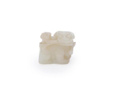 A Chinese white jade Buddhist Lion, Ming Dynasty, holding a Lingzhi fungus in its mouth, 3.5cm long 明 白玉狮子Condition Report: s